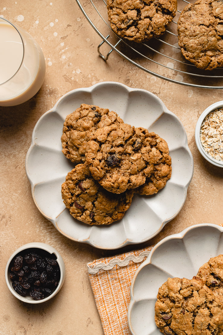 vegan oatmeal raisin cookies on plates flatlay