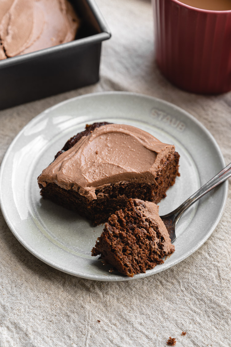 chocolate banana snack cake on a plate with fork