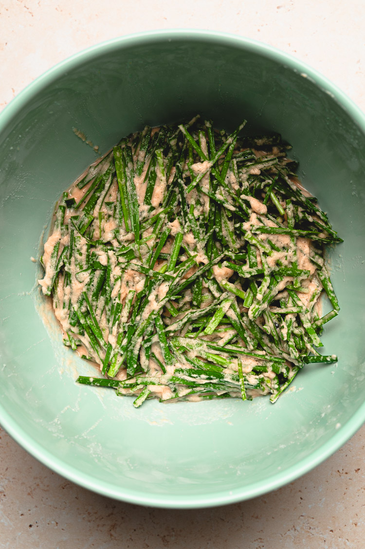 chive pancake batter in a mixing bowl