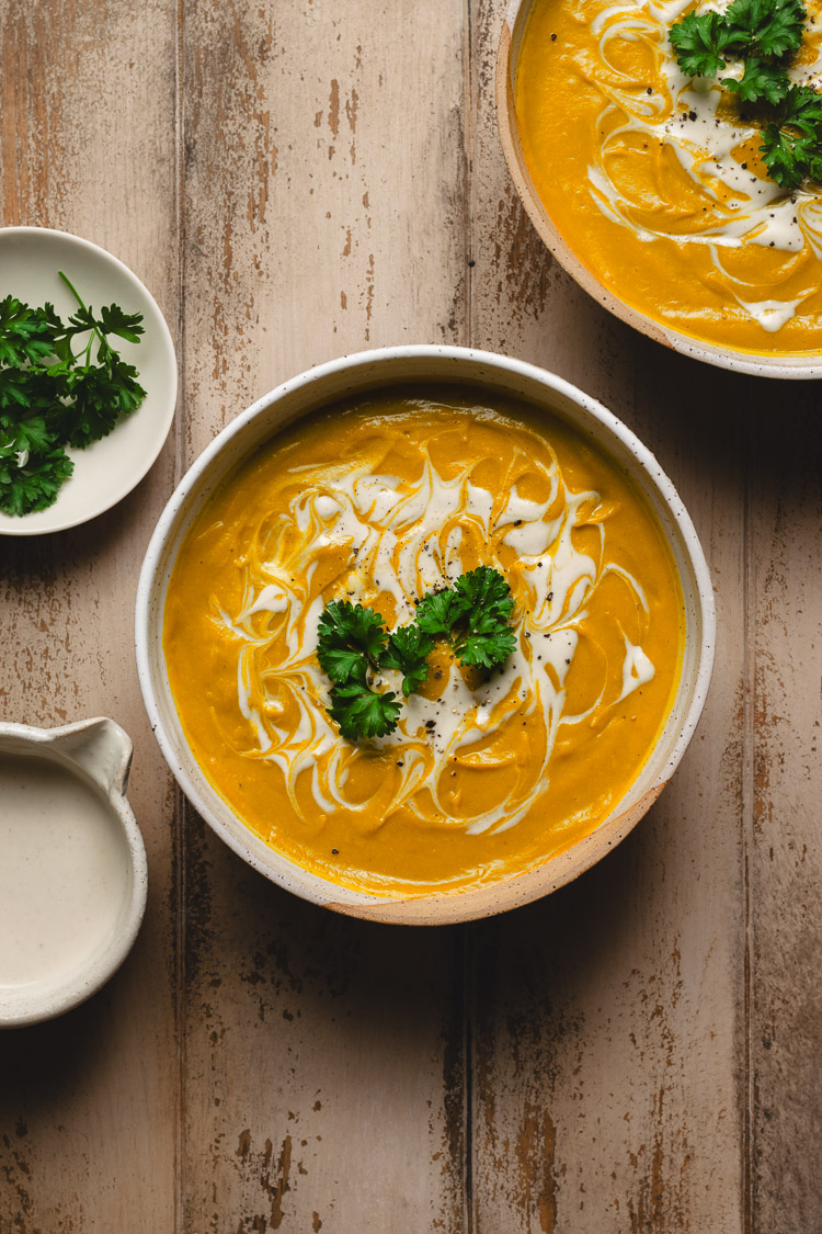 two bowls of vegan kabocha soup