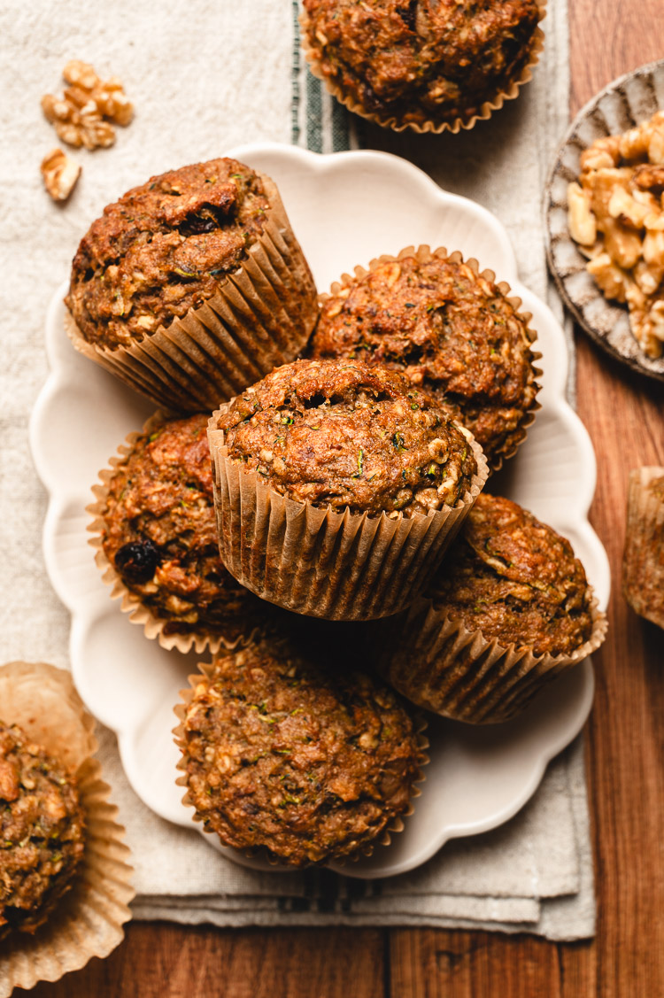 zucchini oatmeal muffins stacked on a plate