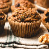 zucchini oatmeal muffins arranged on a dish towel