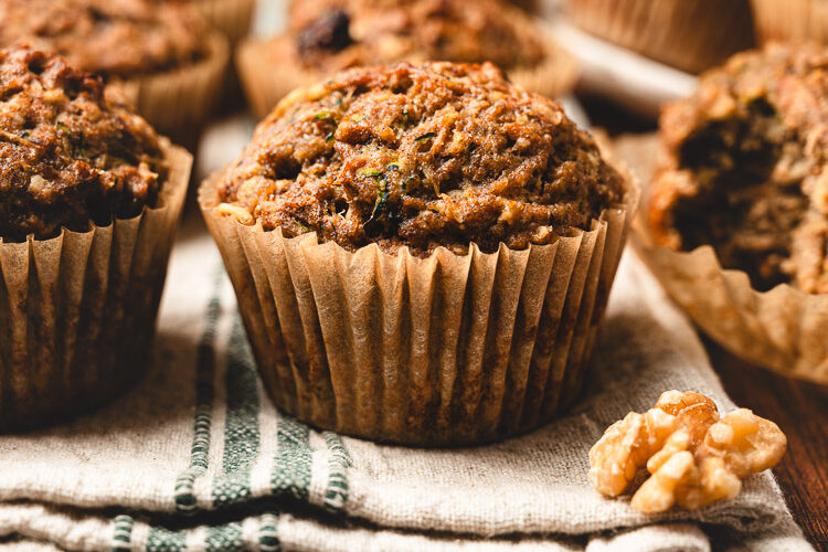 zucchini oatmeal muffins arranged on a dish towel