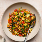 spiced bean salad in a bowl with a spoon