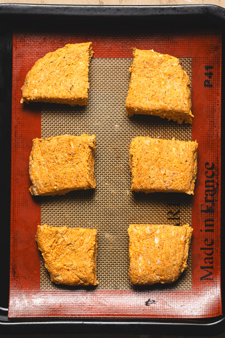 vegan pumpkin biscuits on baking sheet before baking