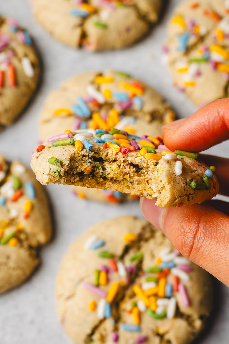 funfetti cookie with a bite taken out of it