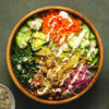 vegan kale caesar salad in mixing bowl