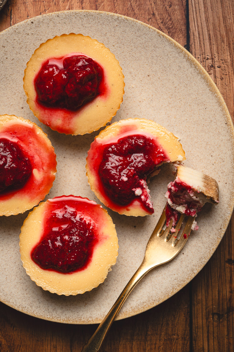 mini vegan cheesecakes with strawberry compote on a plate