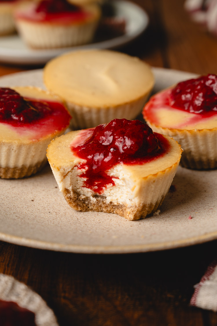 mini vegan cheesecake with a bite taken out of it