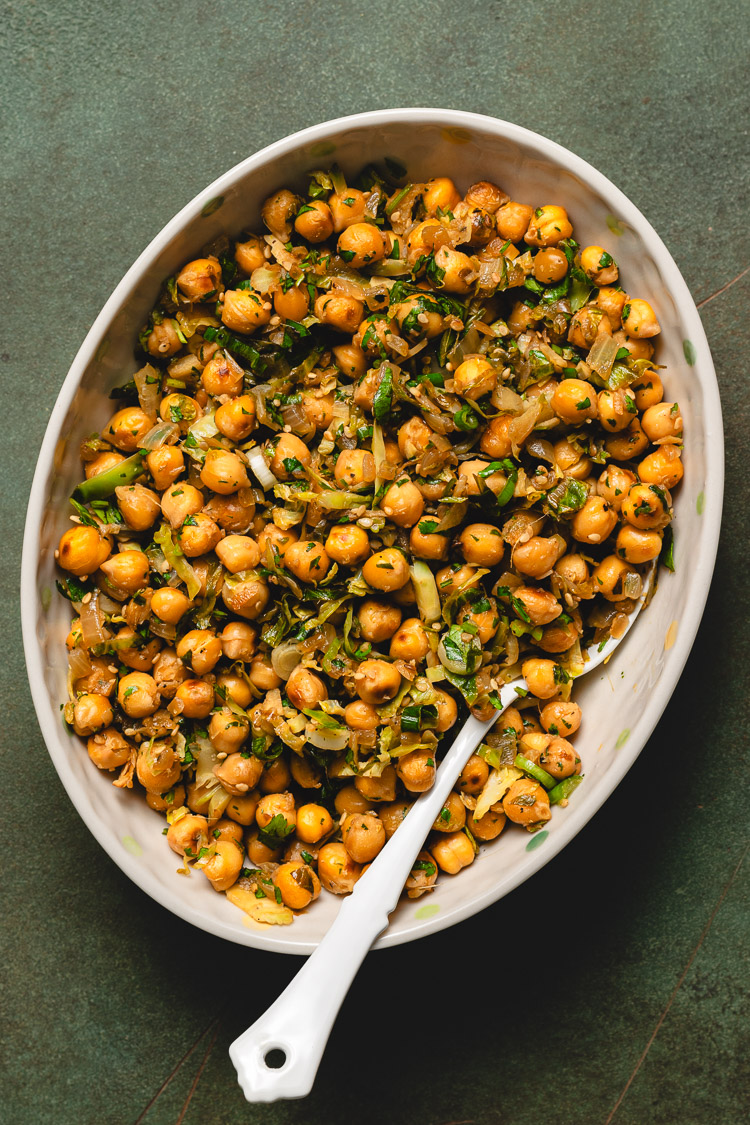 sesame lemon chickpeas in serving bowl with spoon