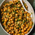 sesame lemon chickpeas in serving bowl with spoon