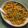 sesame lemon chickpeas in serving bowl with spoon