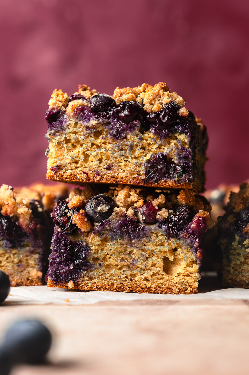 two pieces of blueberry coffee cake stacked