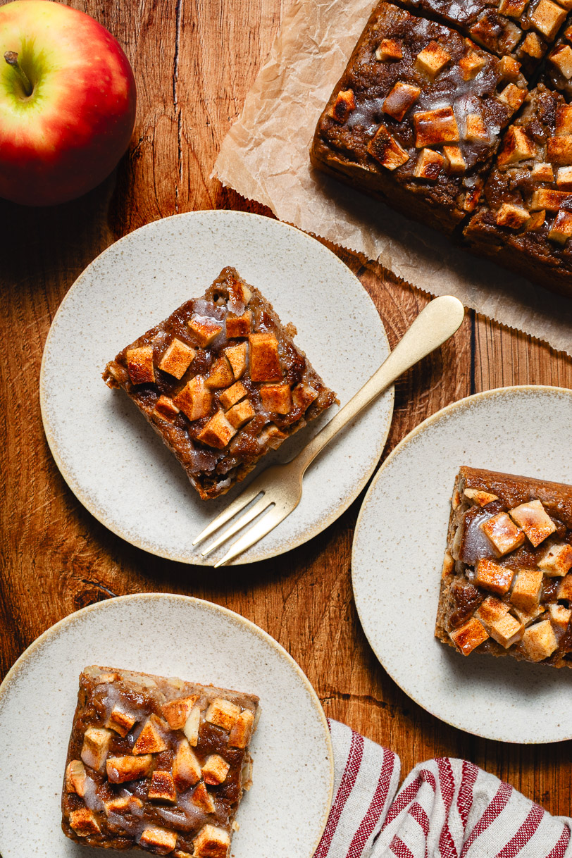 overhead shot of vegan apple fritter cake slices on plates