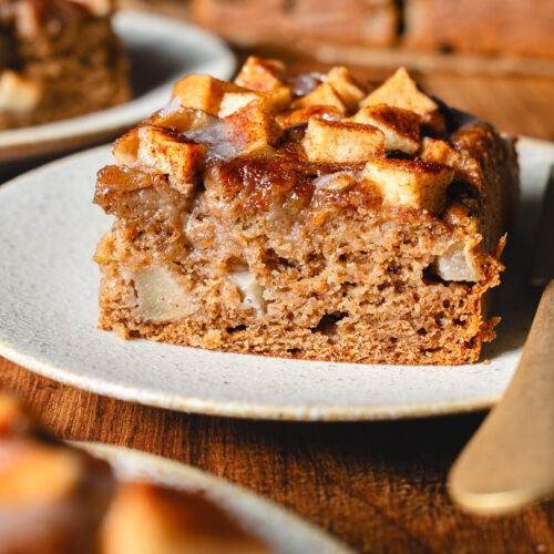 a slice of vegan apple fritter cake on a plate