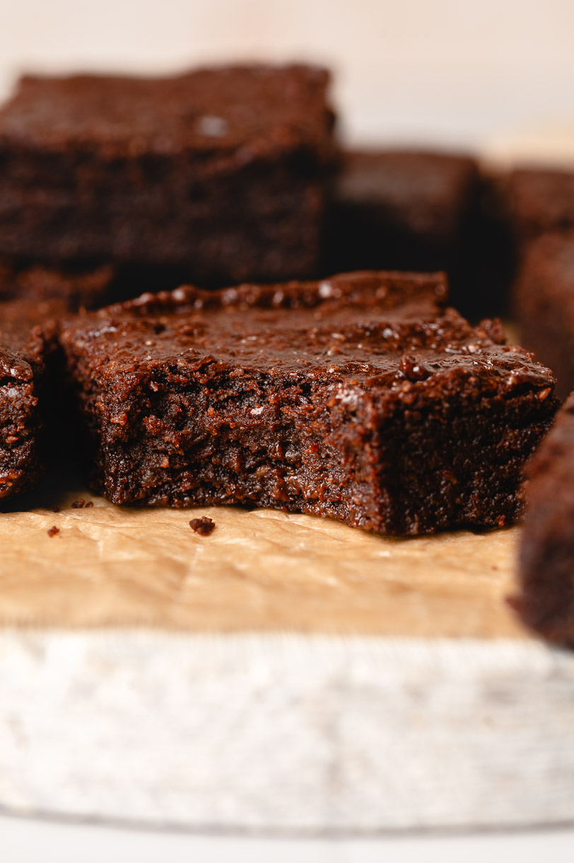 vegan brownies with a bite taken out of one